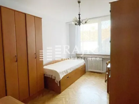 Furnished bedroom with wardrobes, a bed, and a window. - image 5