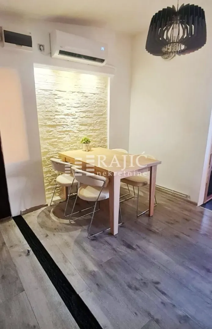 Dining area with a dining table and chairs.