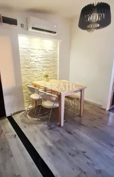 Dining area with a dining table and chairs. - image 4