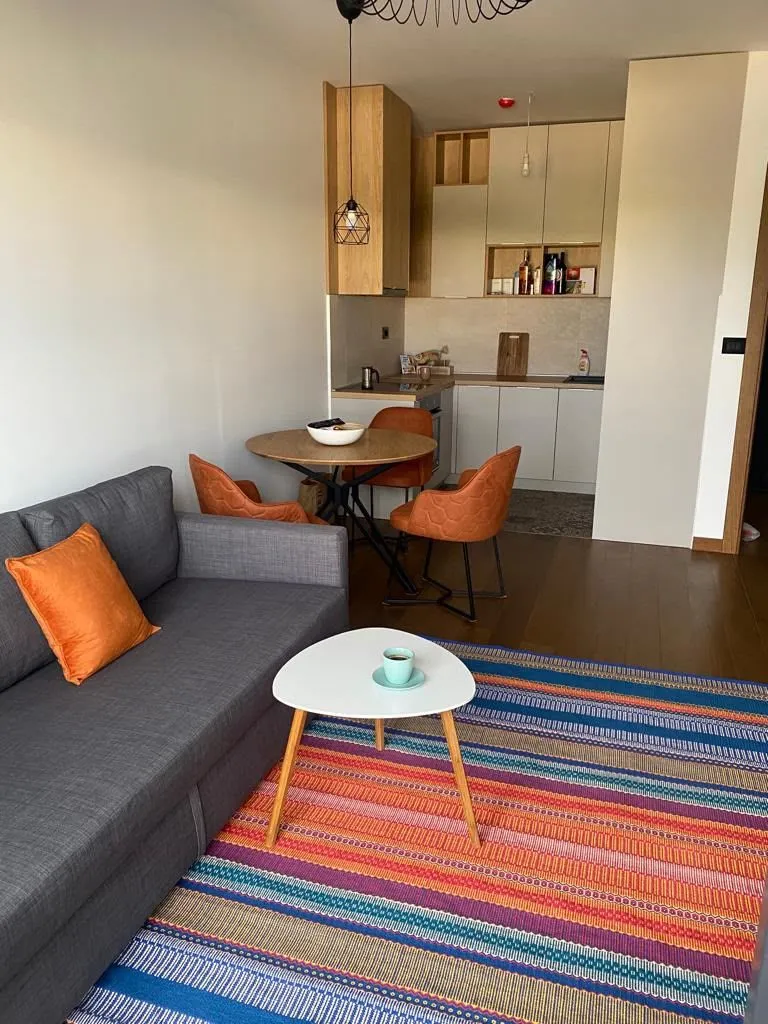 Living room connected to the dining area and kitchen.