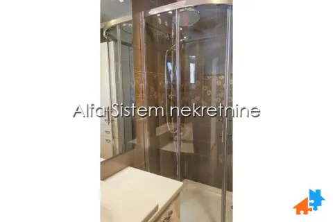 Bathroom with a shower cabin and a sink. - image 19