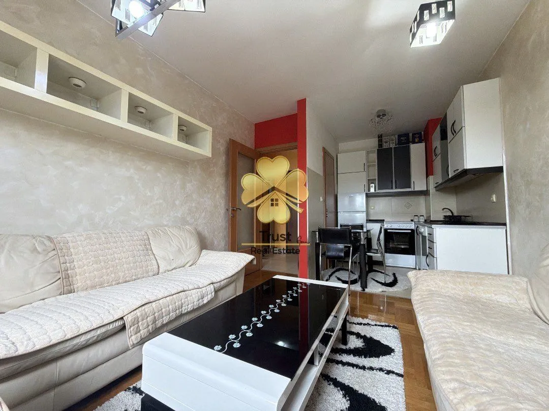 Living room connected to the dining area and kitchen.