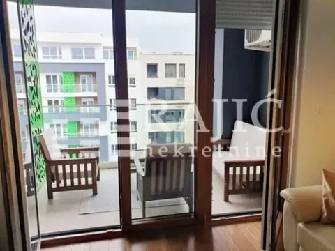Furnished terrace with seating set and view of buildings. - image 6