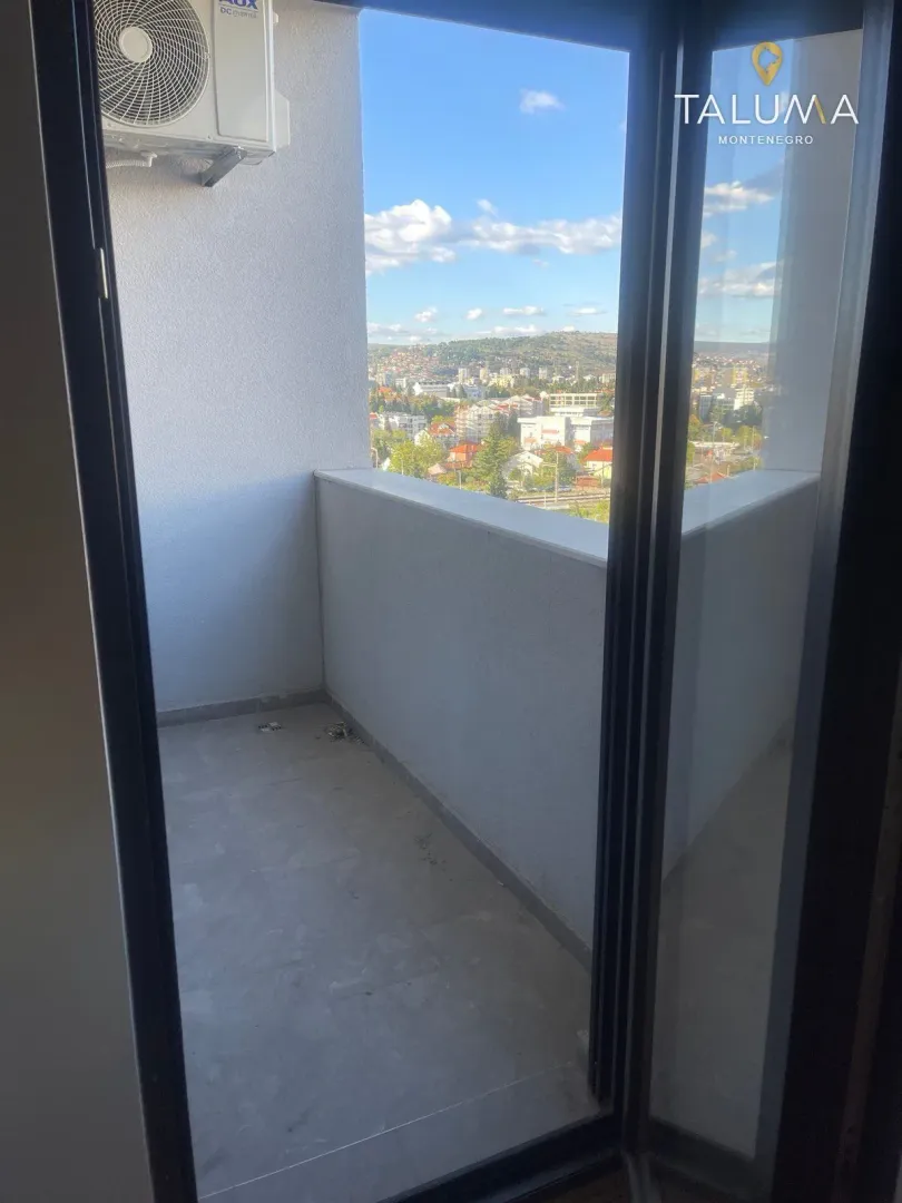 View of the city and surrounding hills from the balcony.