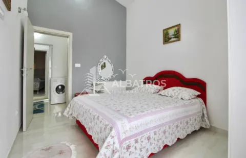 Furnished bedroom with a double bed and a view of the hallway. - image 6