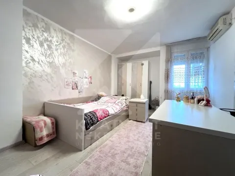 Children's bedroom with a bed, wardrobe, and desk. - image 8