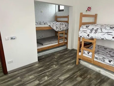 A bedroom with bunk beds. - image 9