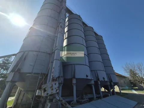 View of large industrial silos from the outside. - image 3