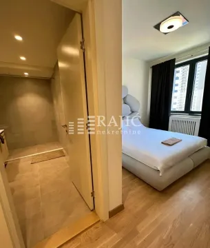 View from the hallway towards the bedroom and bathroom. - image 5
