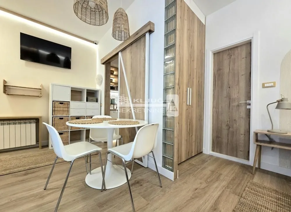 Living room with a dining table and chairs.