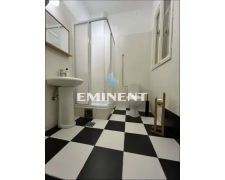 Bathroom with a shower cabin and black and white ceramic floor tiles. - image 16