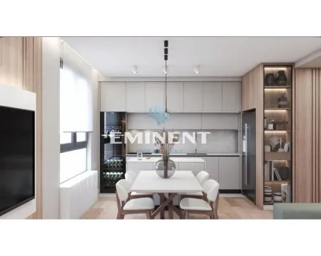 Modern kitchen with dining area and built-in appliances. - image 2