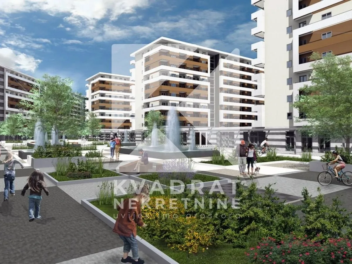 Render kompleksa zgrada sa uređenim dvorištem, fontanom i zelenim površinama.