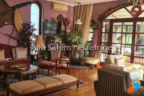 Spacious living room with seating furniture and wooden interior. - image 2