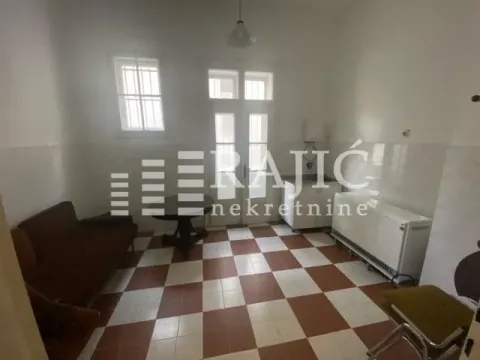 Living room with a dining table and kitchen units. - image 5