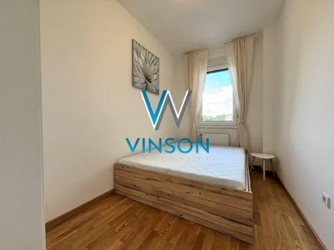 Small bedroom with a double bed, window, and wooden flooring. - image 9