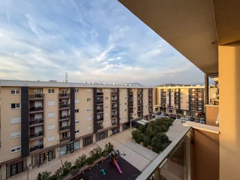 View from the terrace overlooking the surrounding residential buildings and courtyard. - image 7