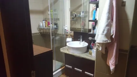 Bathroom with a shower cabin, sink, and mirror. - image 7