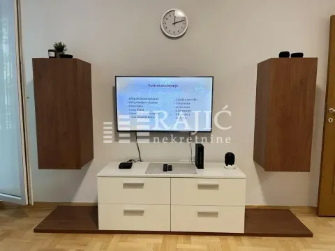 Living room with a TV cabinet and wall units. - image 3