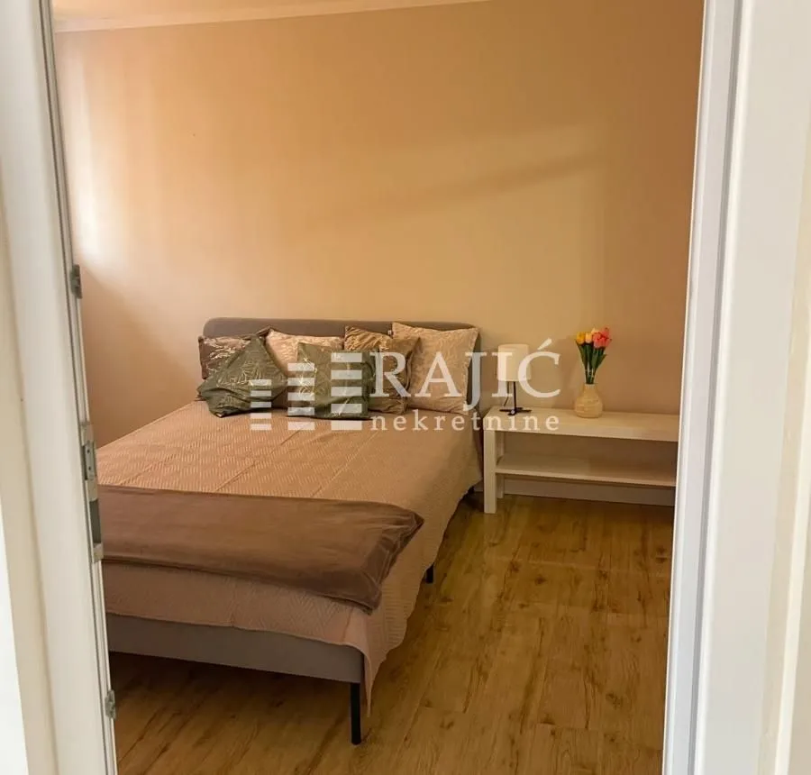 Furnished bedroom with a double bed.