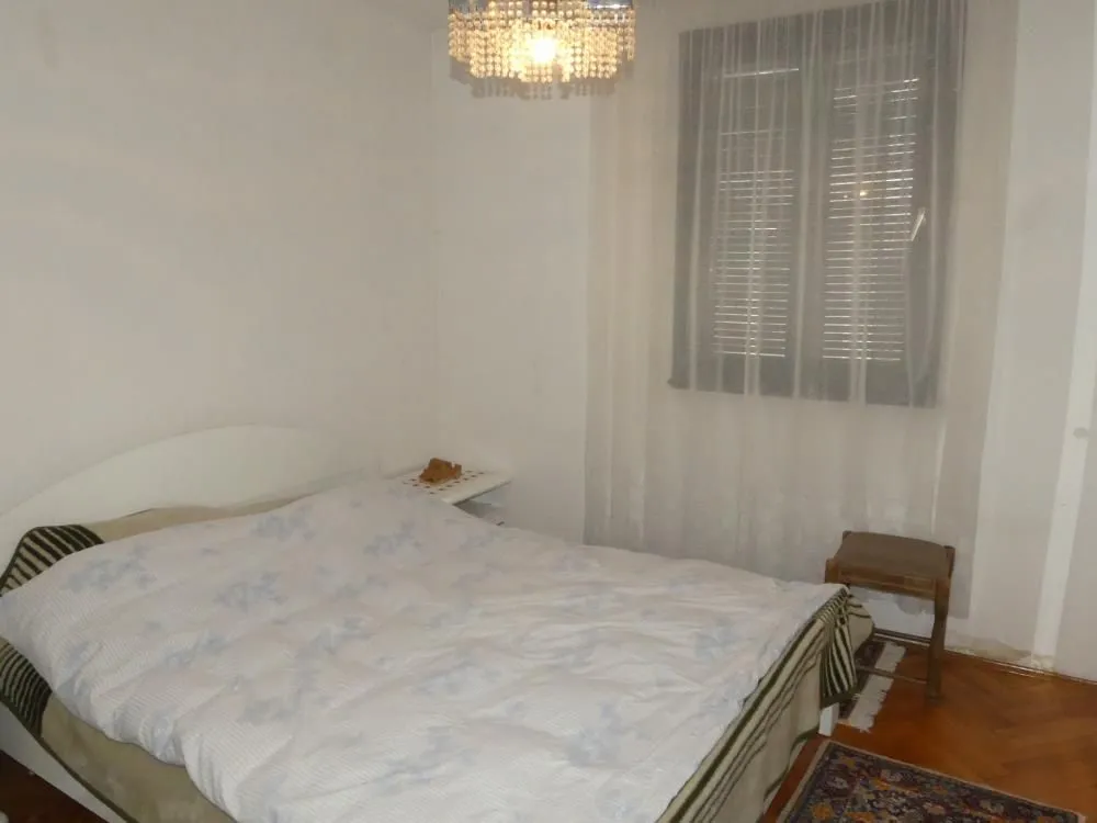Bedroom with a double bed and a window.