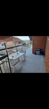 Spacious terrace with outdoor seating and a view of the surroundings. - image 7