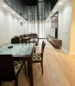 Living room with dining area and modern furniture. - image 3