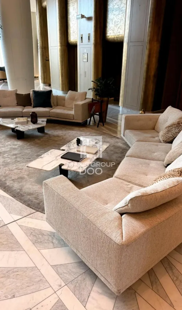 Spacious living room with seating sets and a coffee table.