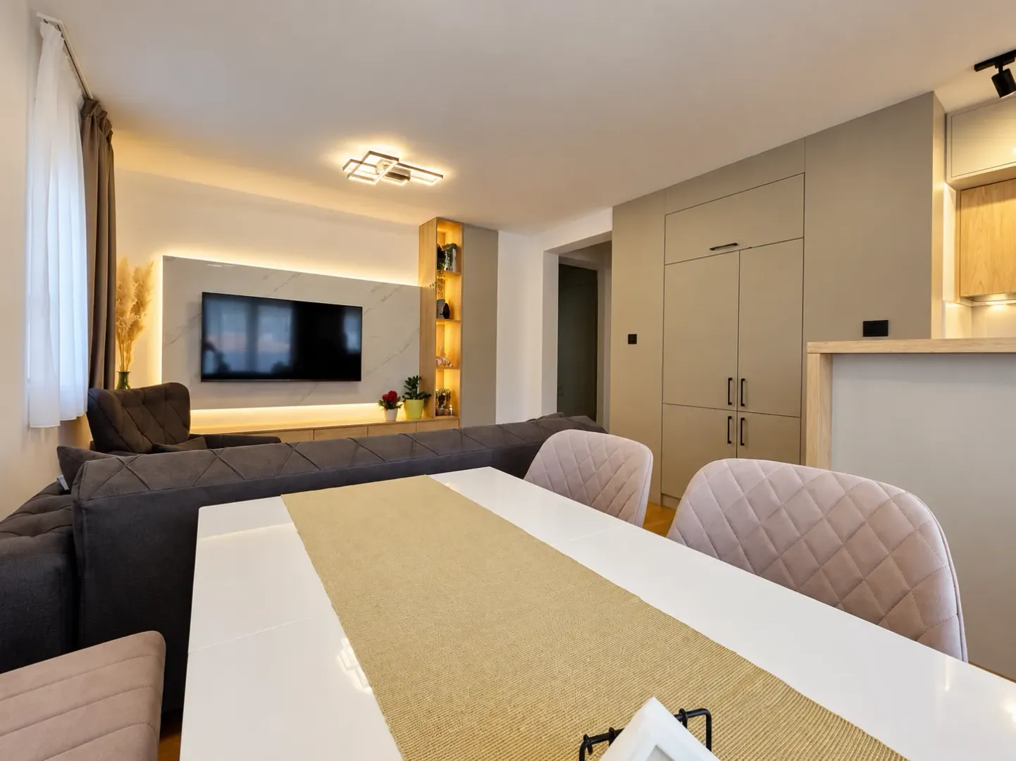 Living room with a dining area and modern furniture.