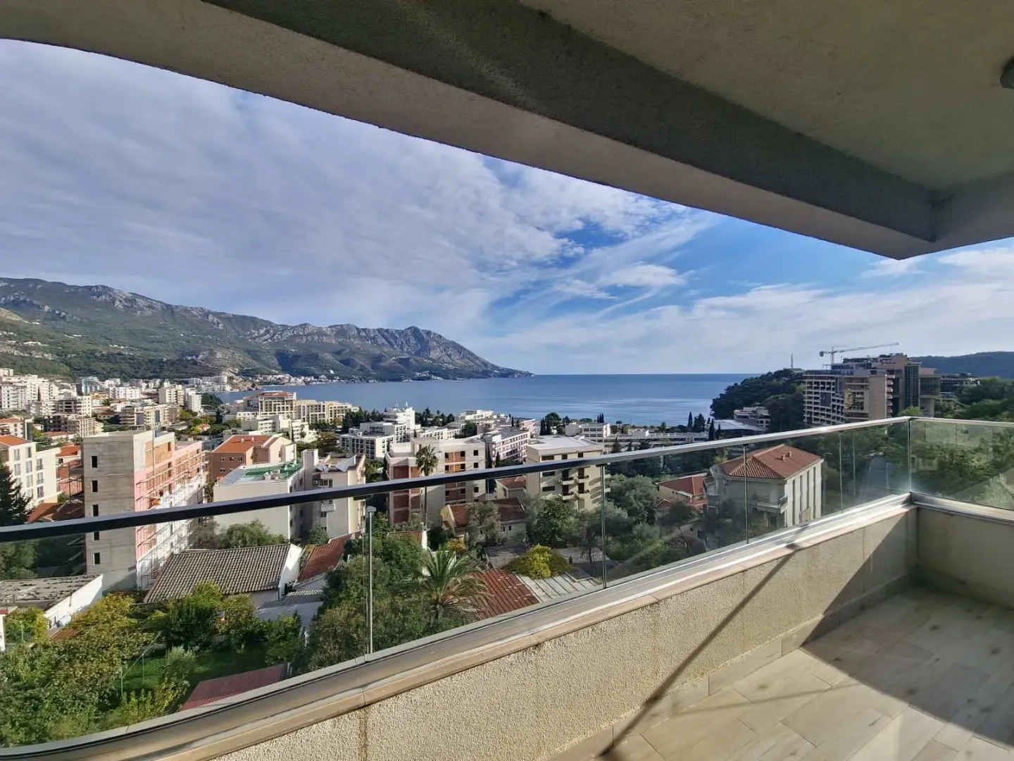 View of the city, sea and surrounding mountains from the terrace.