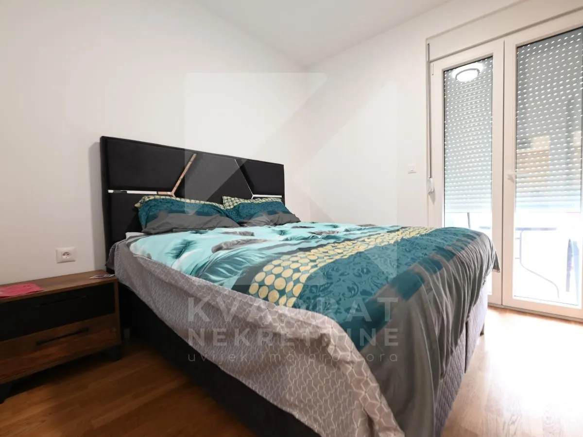 Bedroom with a double bed and terrace access.