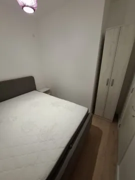 Bedroom with a double bed and a wardrobe. - image 9