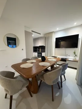 Living room with dining area and view of the kitchen. - image 14