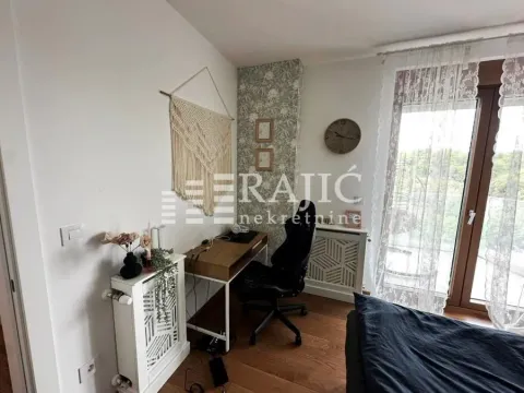 Furnished bedroom with a desk and access to the terrace. - image 6