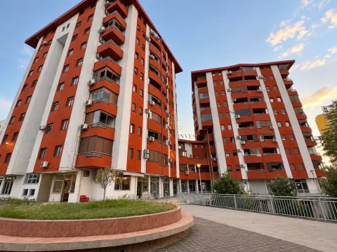 View of the modern residential building facade with balconies and landscaped courtyard. - image 8