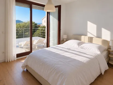 Bright bedroom with a double bed and access to a terrace with a view. - image 8