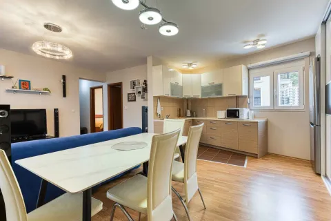 Living room with dining area and kitchen. - image 7