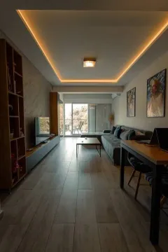 Modern living room with a sofa, dining table, and access to the terrace. - image 17