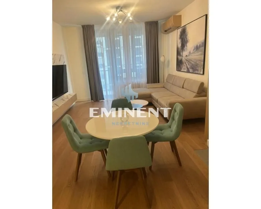 Living room with a dining area and seating set.