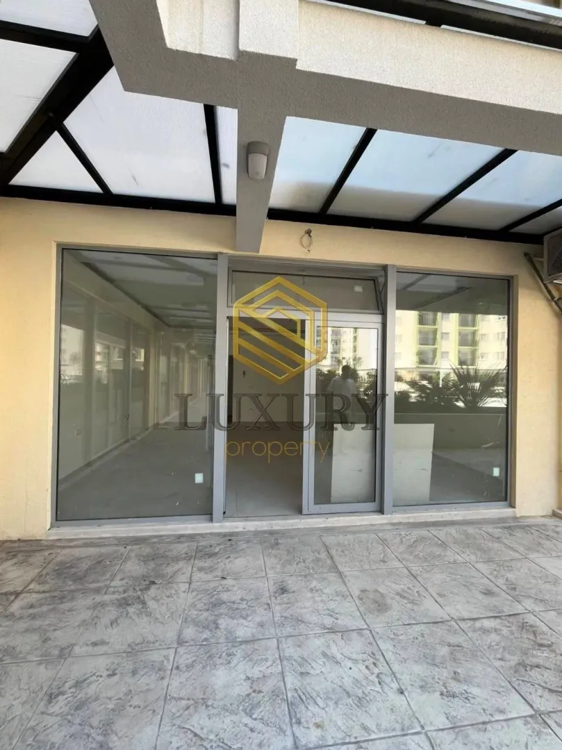Entrance to a commercial space with a covered terrace.