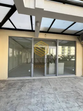 Entrance to a commercial space with a covered terrace. - image 8