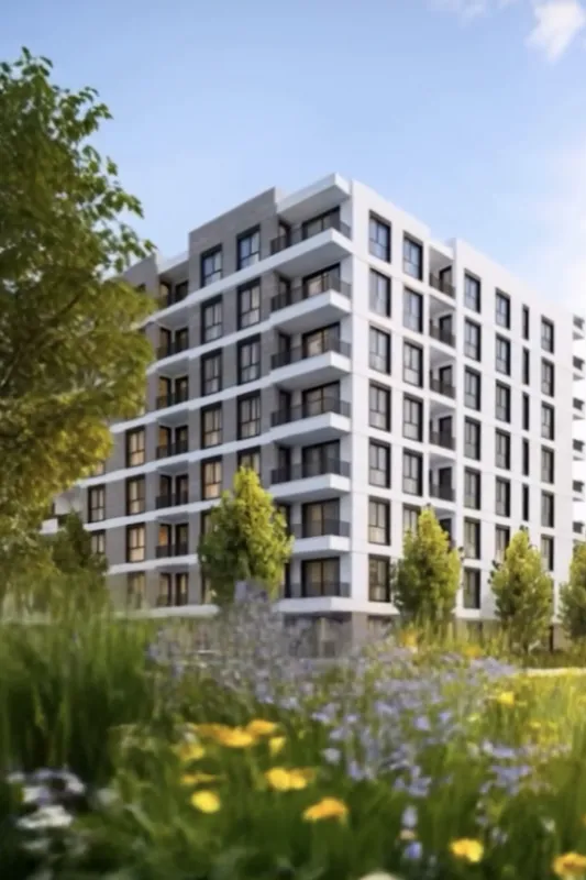 Exterior of a modern residential building with landscaped green space and balconies.
