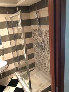 Modernly equipped bathroom with a shower cabin. - image 6