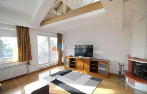 Spacious living room with a fireplace, TV unit, and an upper-floor gallery. - image 13