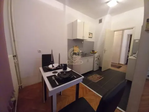 Small kitchen with a dining table and chairs. - image 7