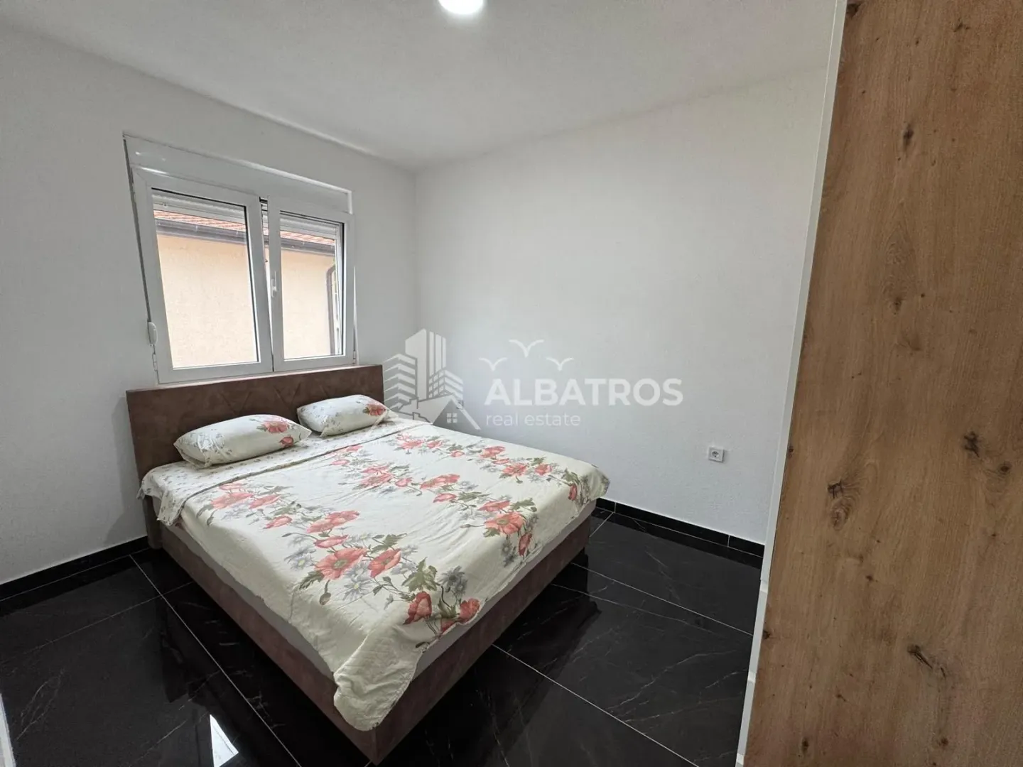 Bedroom with a double bed and a window.