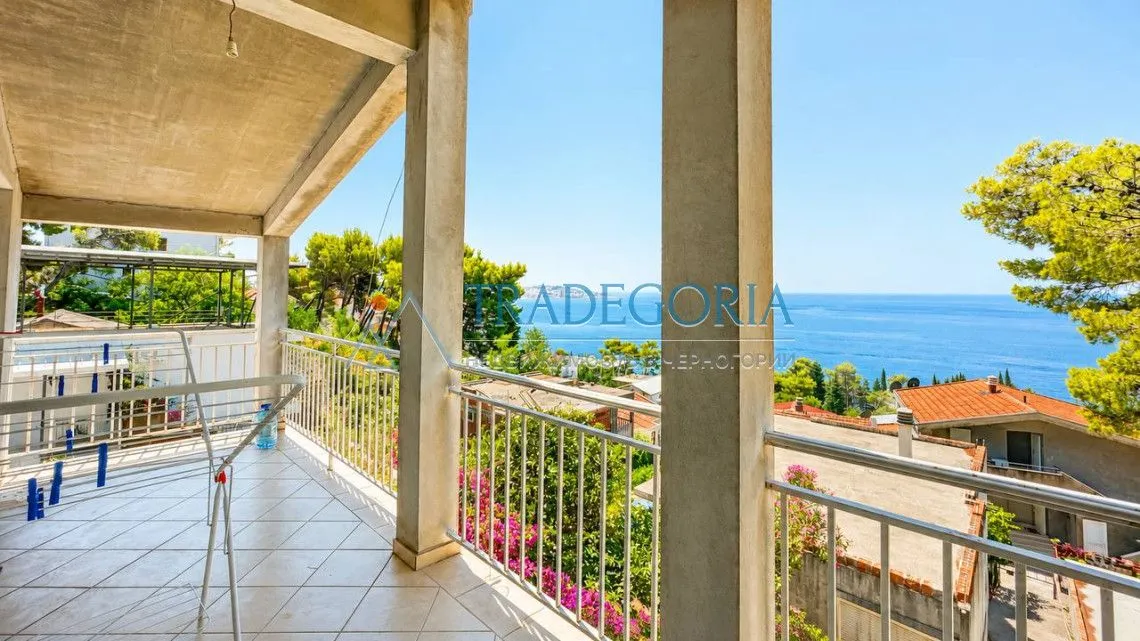 Spacious covered terrace with a sea view.