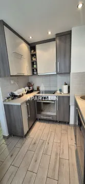 Small kitchen with built-in cabinetry and appliances. - image 17