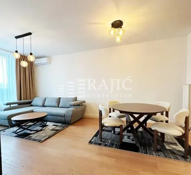 Living room with a sofa set and dining table. - image 8