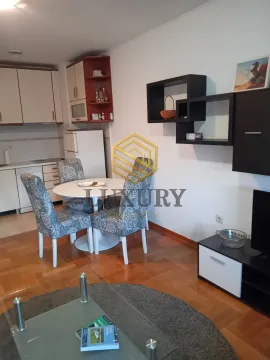 Living room with dining area and kitchen in the background. - image 2